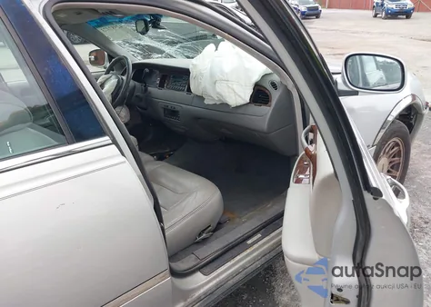 1999 Lincoln Town Car Signature z USA, uszkodzony, nr VIN 1LNFM82W2XY600959